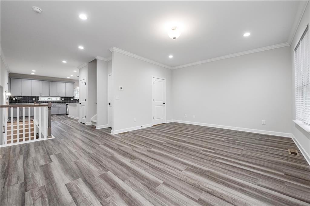 2010 Main Street Northwest Atlanta, GA 30318 - Photo 10 of 37 an empty room with wooden floor and windows