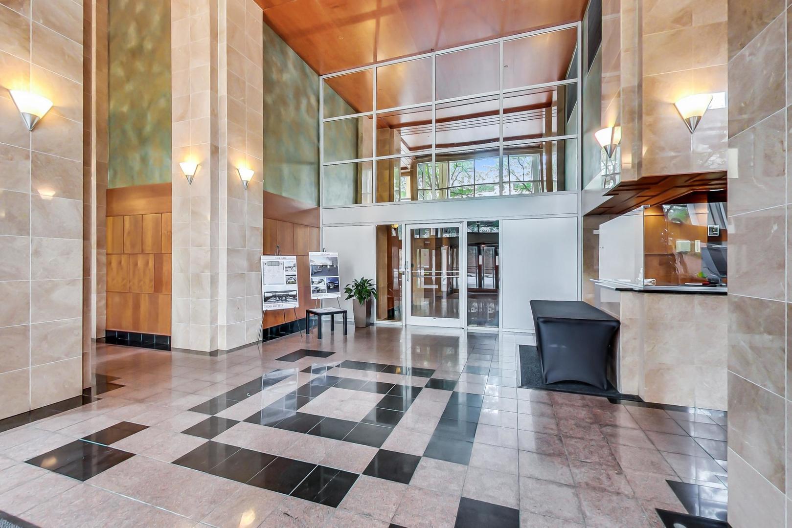 1122 North Clark Street, Unit 3705 Chicago, IL 60610 - Photo 2 of 38 a view of a building with sitting area