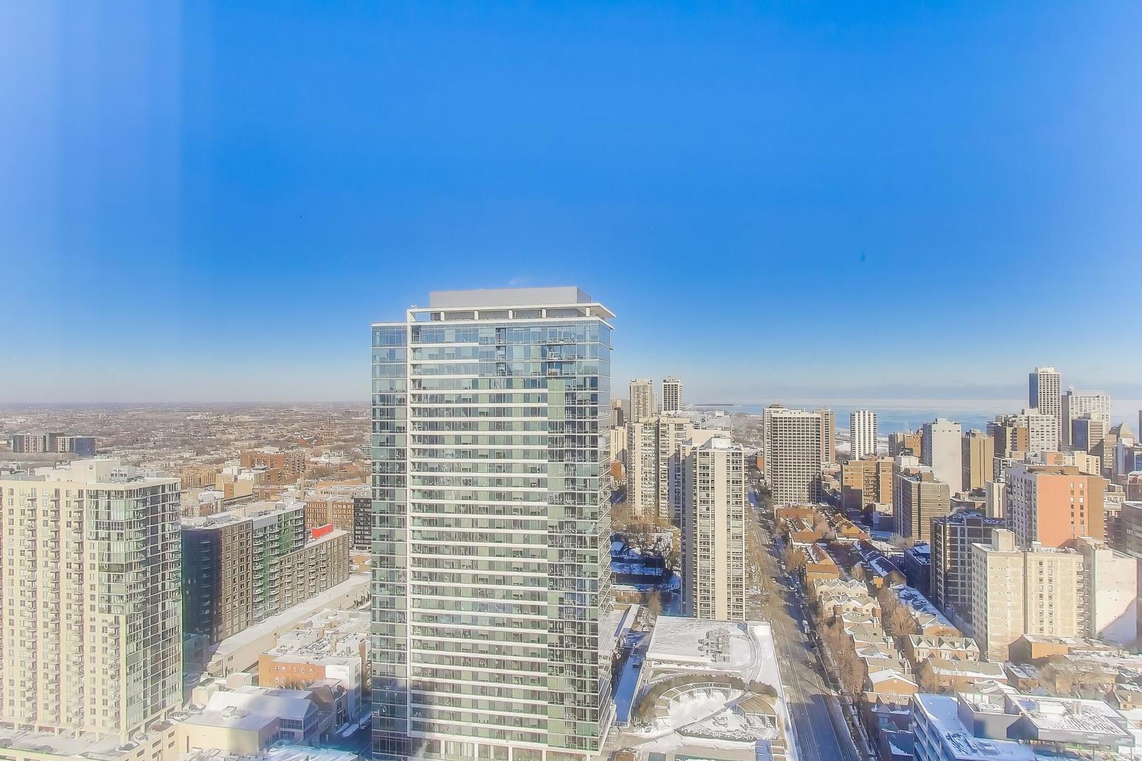 1122 North Clark Street, Unit 3705 Chicago, IL 60610 - Photo 23 of 38 a view of a city with tall buildings