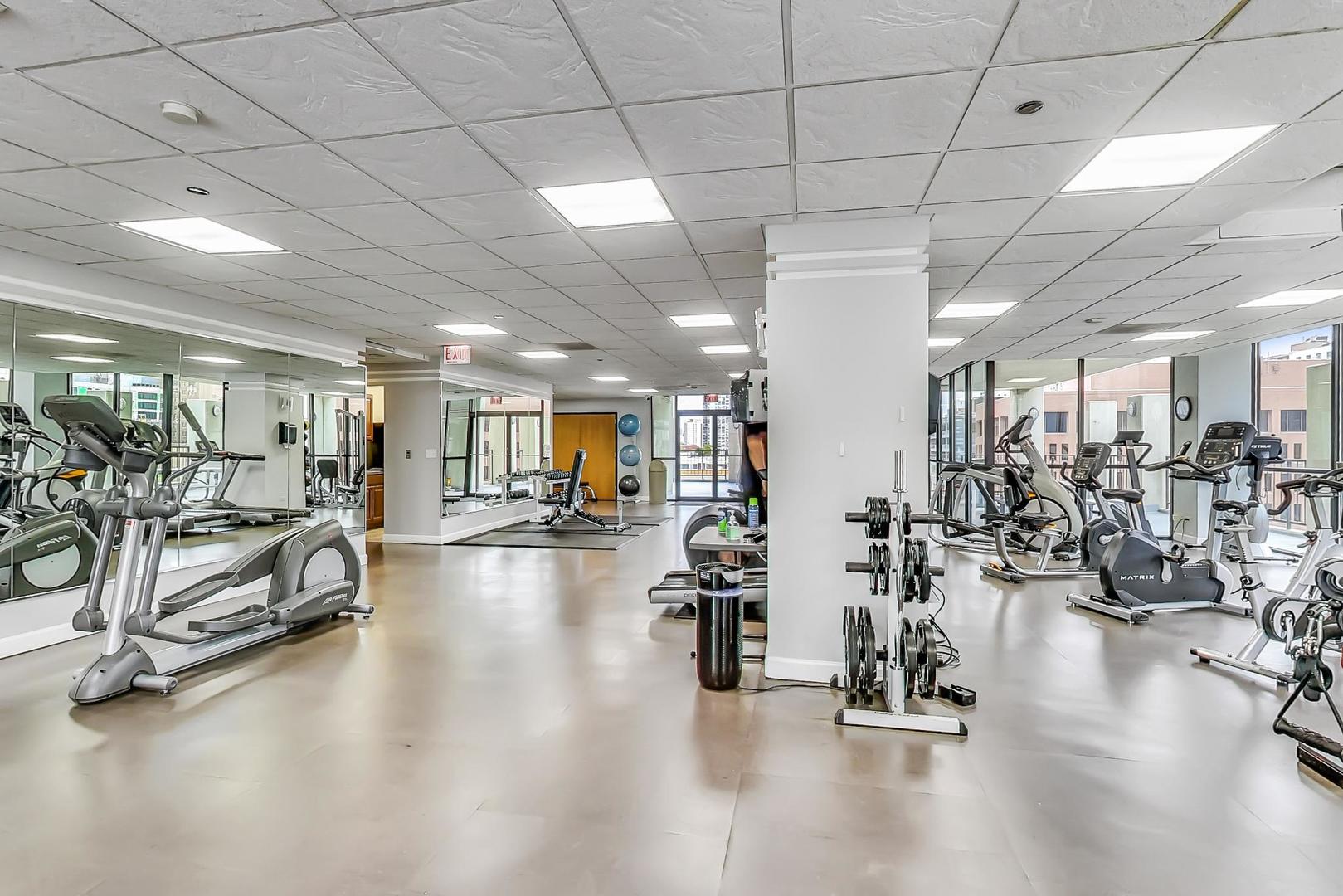 1122 North Clark Street, Unit 3705 Chicago, IL 60610 - Photo 30 of 38 a view of a room with gym equipment