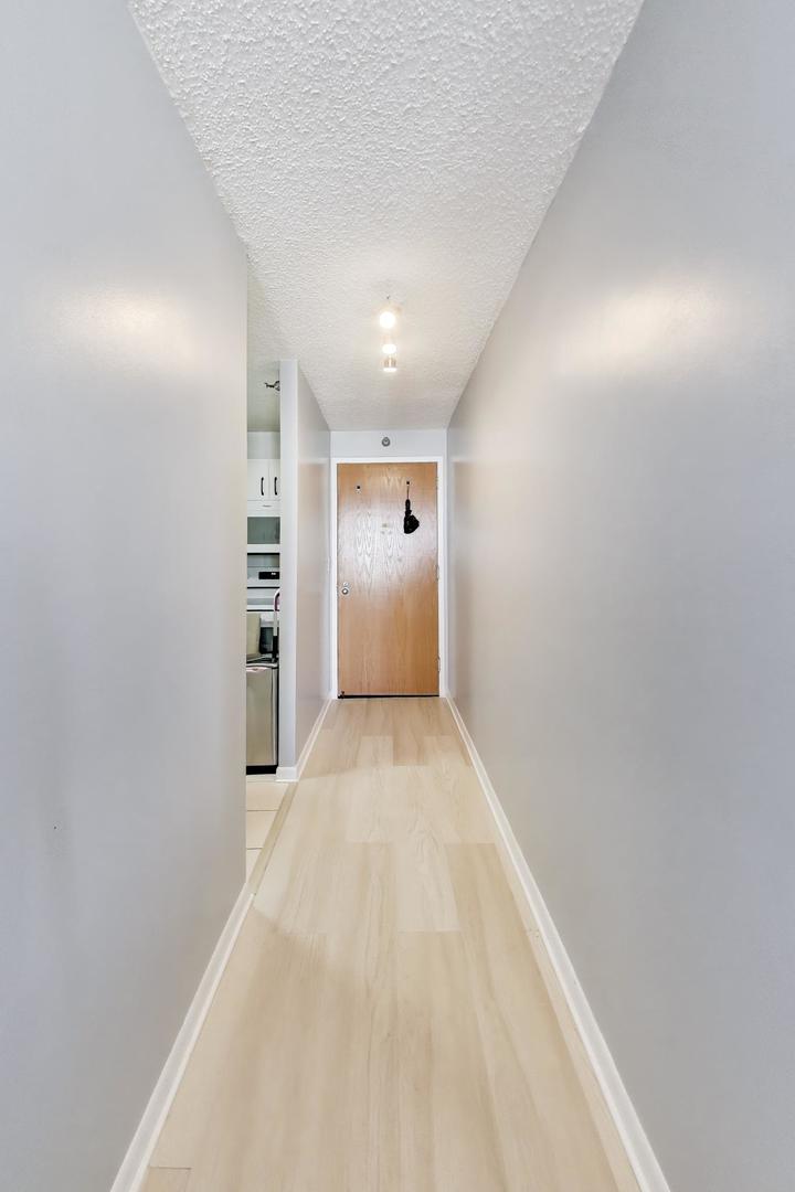 1122 North Clark Street, Unit 3705 Chicago, IL 60610 - Photo 8 of 38 a view of an empty room