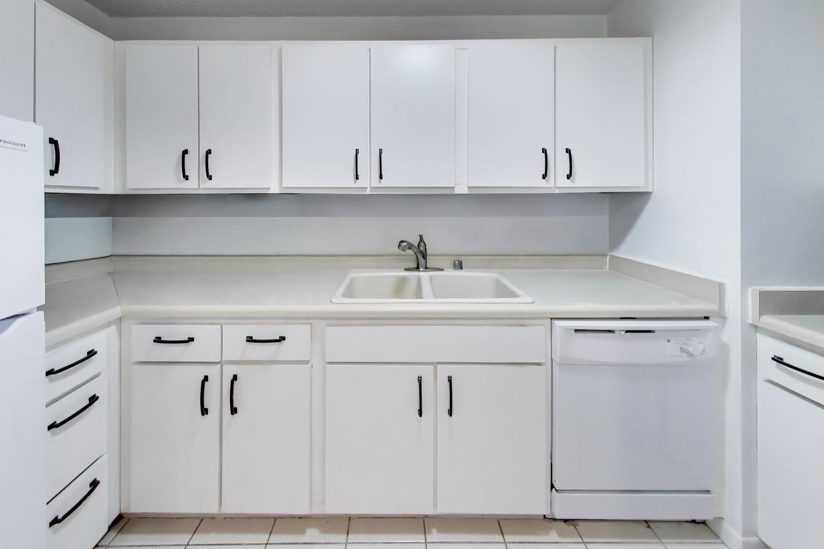 1122 North Clark Street, Unit 3705 Chicago, IL 60610 - Photo 10 of 38 a kitchen with a sink and cabinets