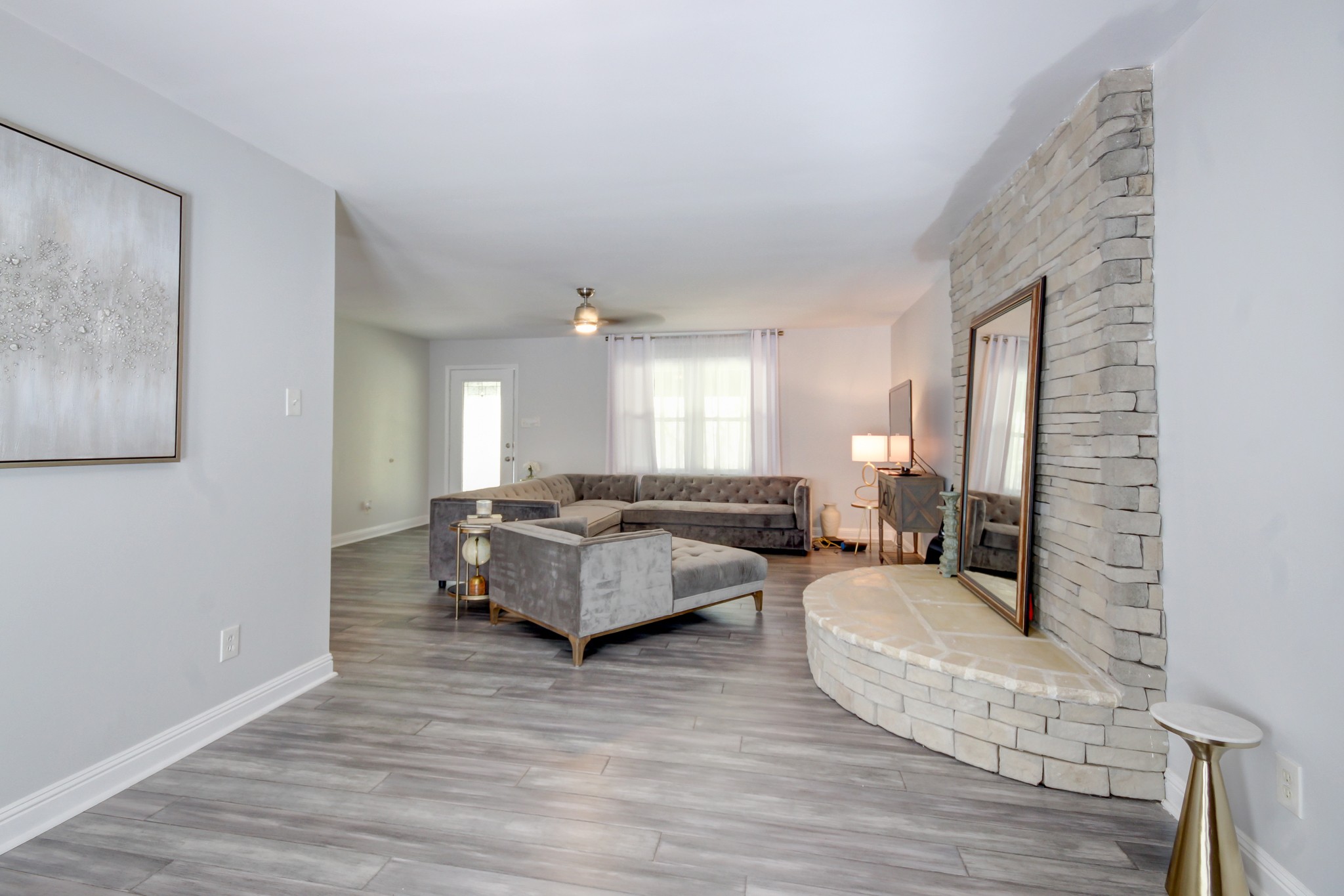 4141 Sango Road Clarksville, TN 37043 - Photo 17 of 57 a living room with furniture and a wooden floor