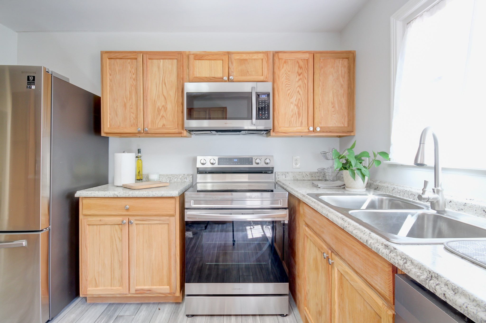 4141 Sango Road Clarksville, TN 37043 - Photo 21 of 57 a kitchen with a sink stove and refrigerator
