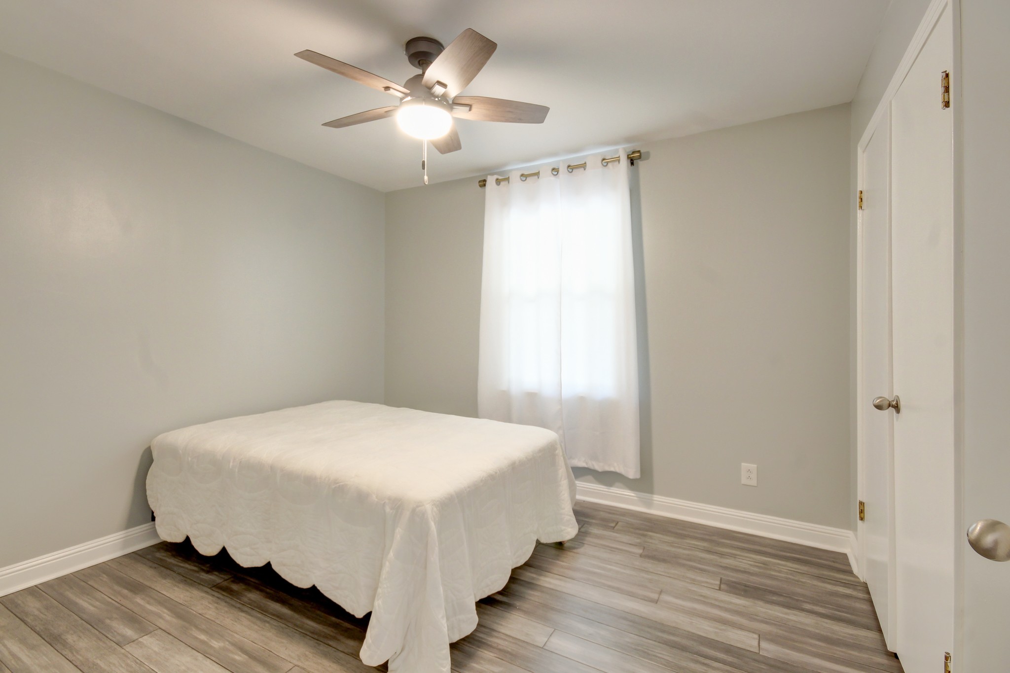 4141 Sango Road Clarksville, TN 37043 - Photo 23 of 57 a bedroom with a bed and a chandelier