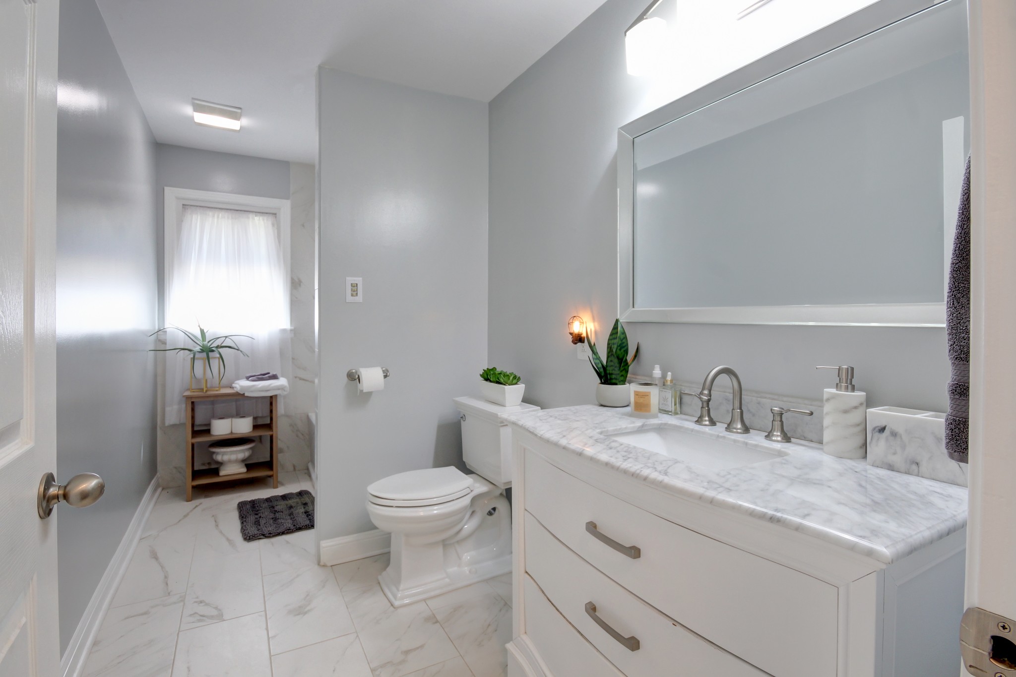 4141 Sango Road Clarksville, TN 37043 - Photo 24 of 57 a bathroom with a granite countertop sink mirror vanity and toilet