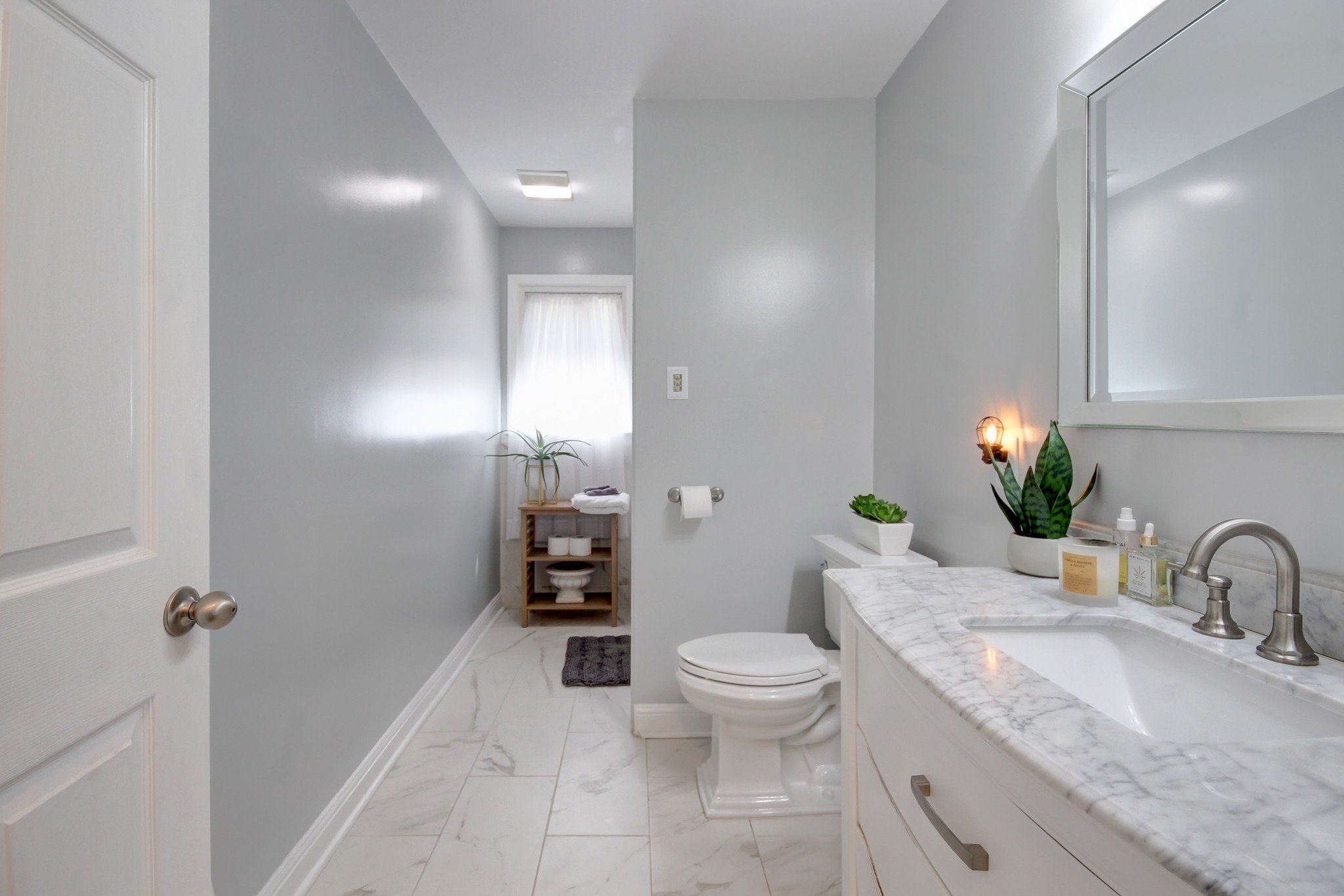 4141 Sango Road Clarksville, TN 37043 - Photo 25 of 57 a bathroom with a granite countertop sink mirror vanity and toilet