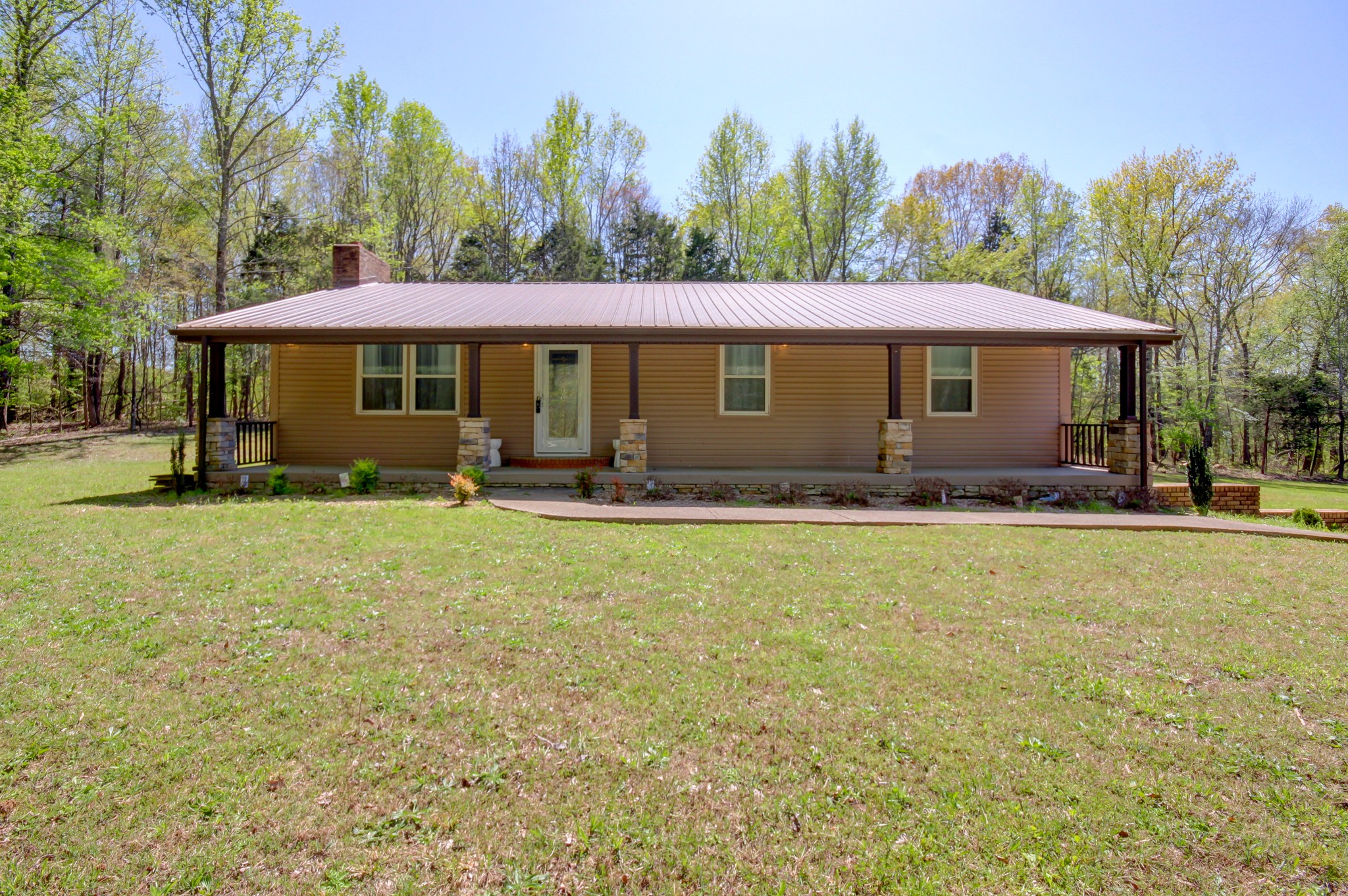 4141 Sango Road Clarksville, TN 37043 - Photo 3 of 57 a front view of a house with garden