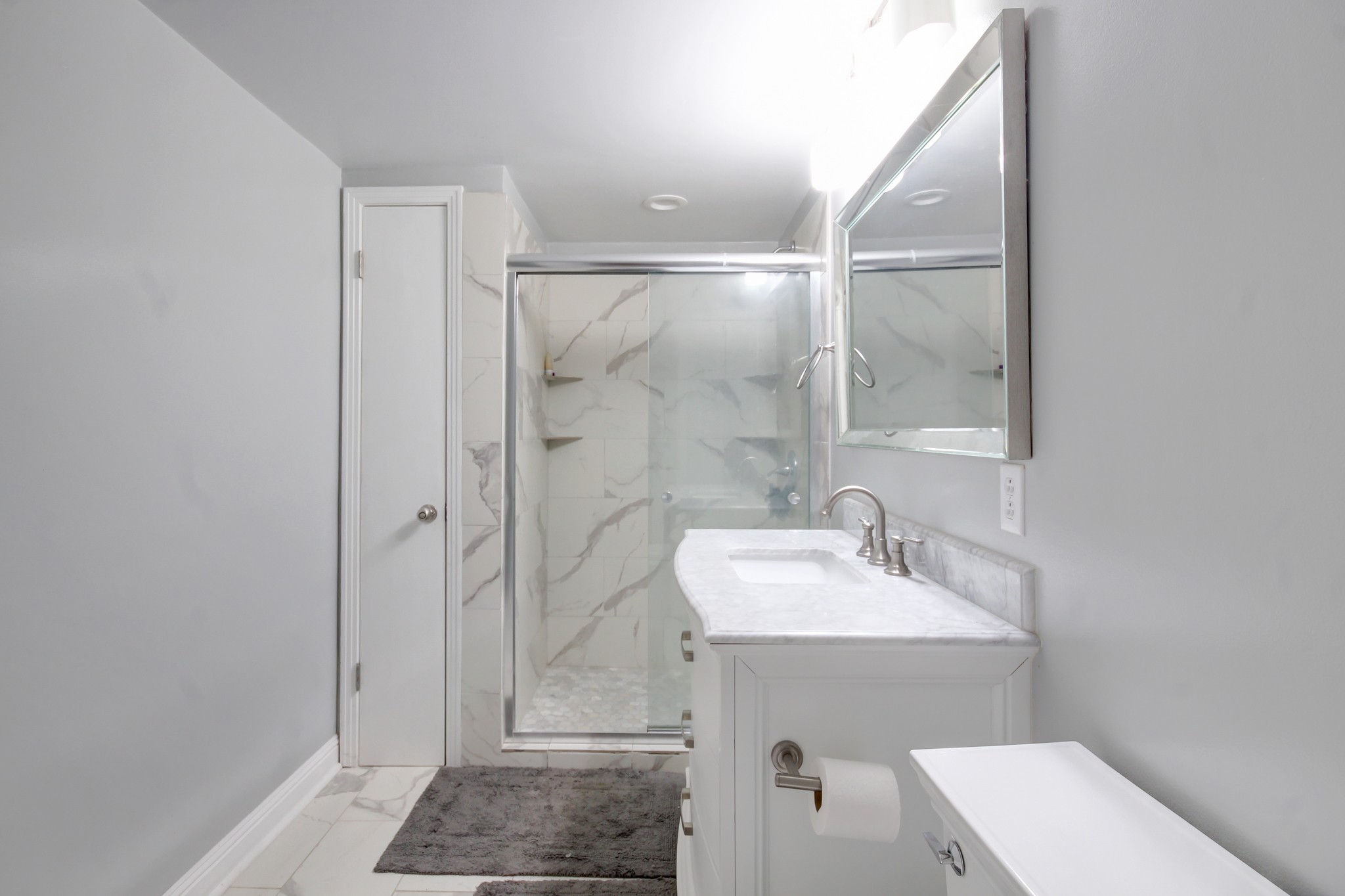 4141 Sango Road Clarksville, TN 37043 - Photo 35 of 57 a bathroom with a sink mirror and shower