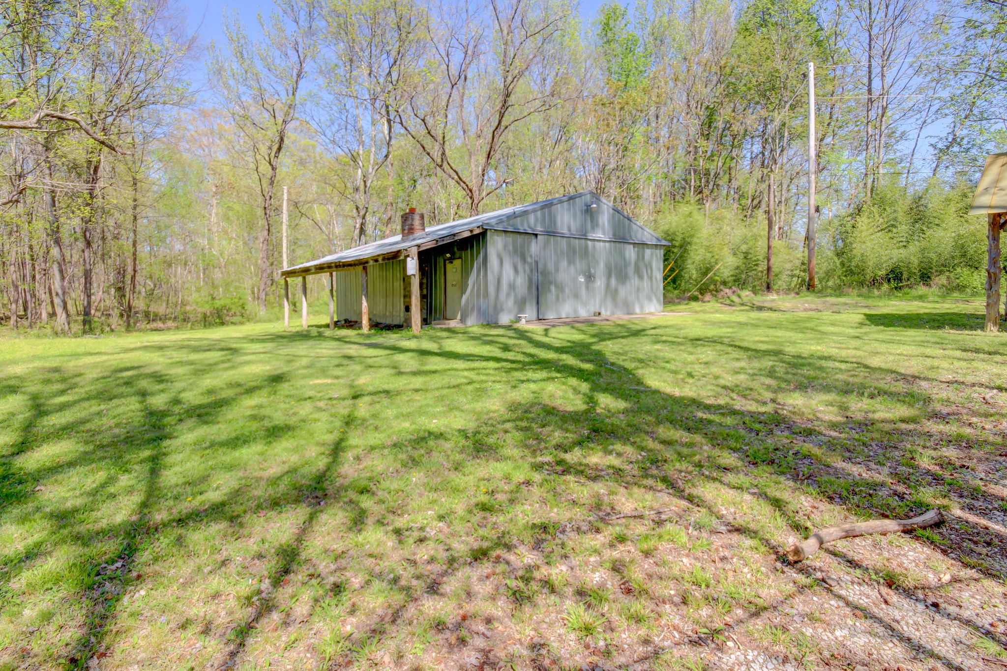4141 Sango Road Clarksville, TN 37043 - Photo 53 of 57 a tall house with a big yard and large trees