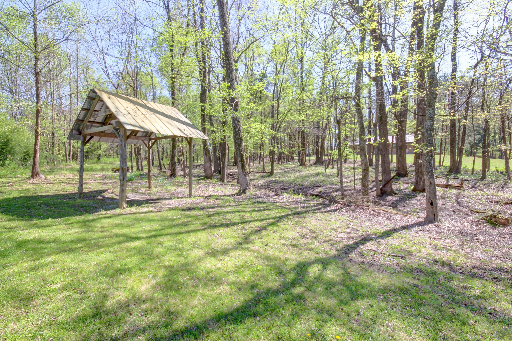4141 Sango Road Clarksville, TN 37043 - Photo 55 of 57 a backyard of a house with lots of green space and fountain