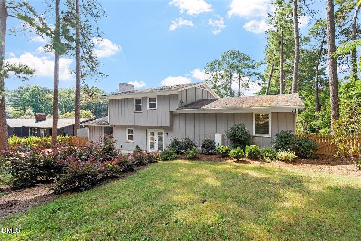 2120 Hillock Drive Raleigh, NC 27612 - Photo 4 of 29 a front view of a house with a yard and potted plants