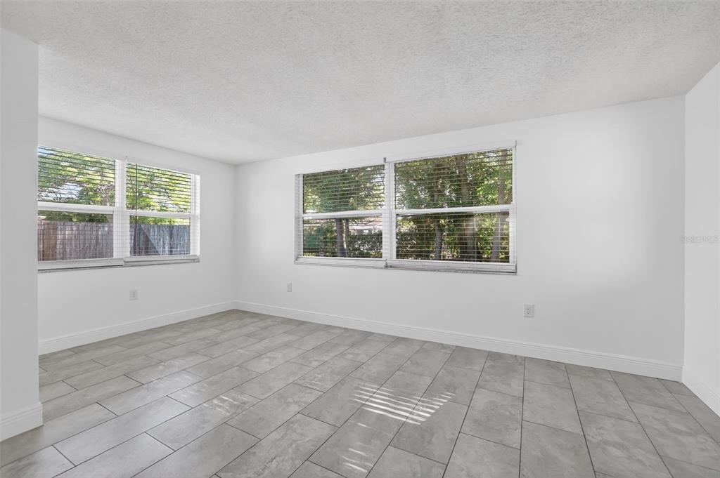 10914 Leeds Road Port Richey, FL 34668 - Photo 17 of 24 an empty room with windows