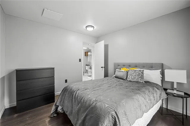 a bedroom with a bed and a dresser