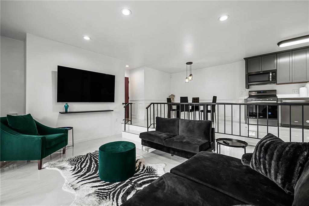 1509 Kenzie Road Pittsburgh, PA 15205 - Photo 22 of 25 a living room with furniture and a flat screen tv