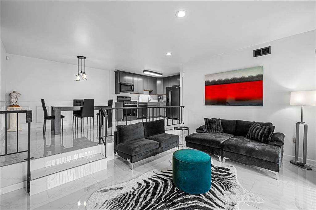 1509 Kenzie Road Pittsburgh, PA 15205 - Photo 23 of 25 a living room with furniture and a flat screen tv