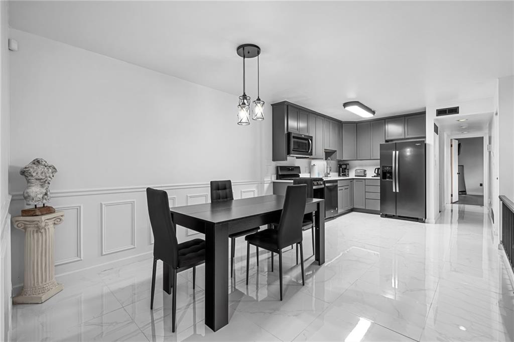 1509 Kenzie Road Pittsburgh, PA 15205 - Photo 7 of 25 a view of a dining room with furniture