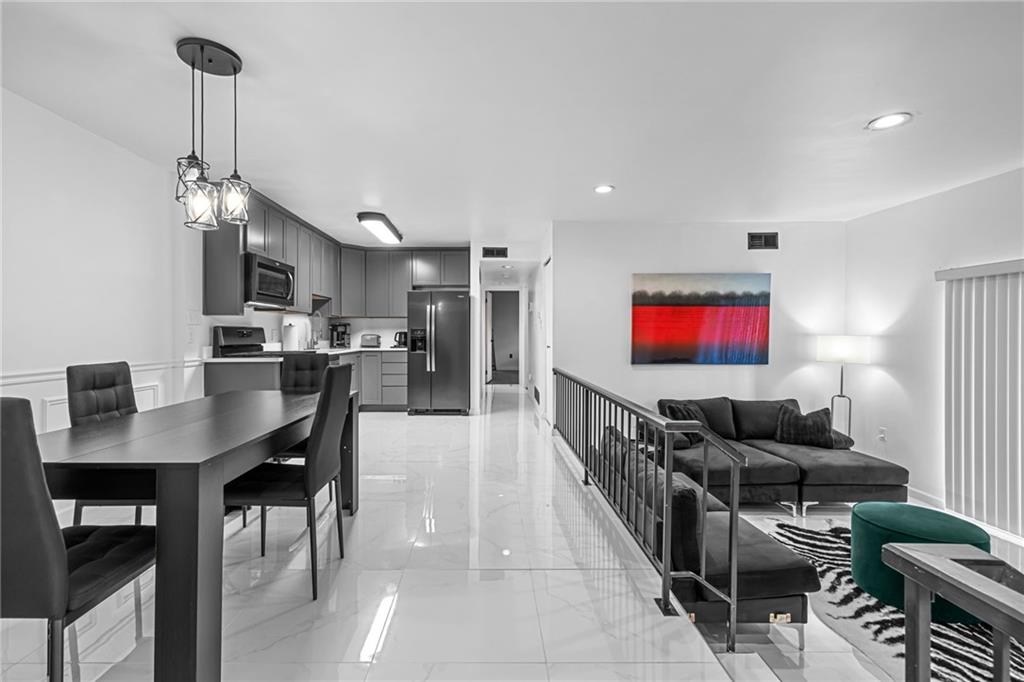 1509 Kenzie Road Pittsburgh, PA 15205 - Photo 8 of 25 a living room with furniture and a flat screen tv