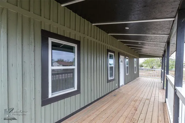 a view of outdoor space with wooden floor