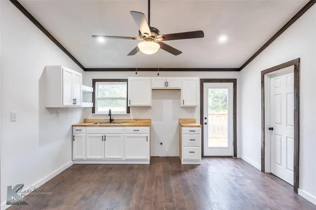 a view of a kitchen with a sink and dishwasher
