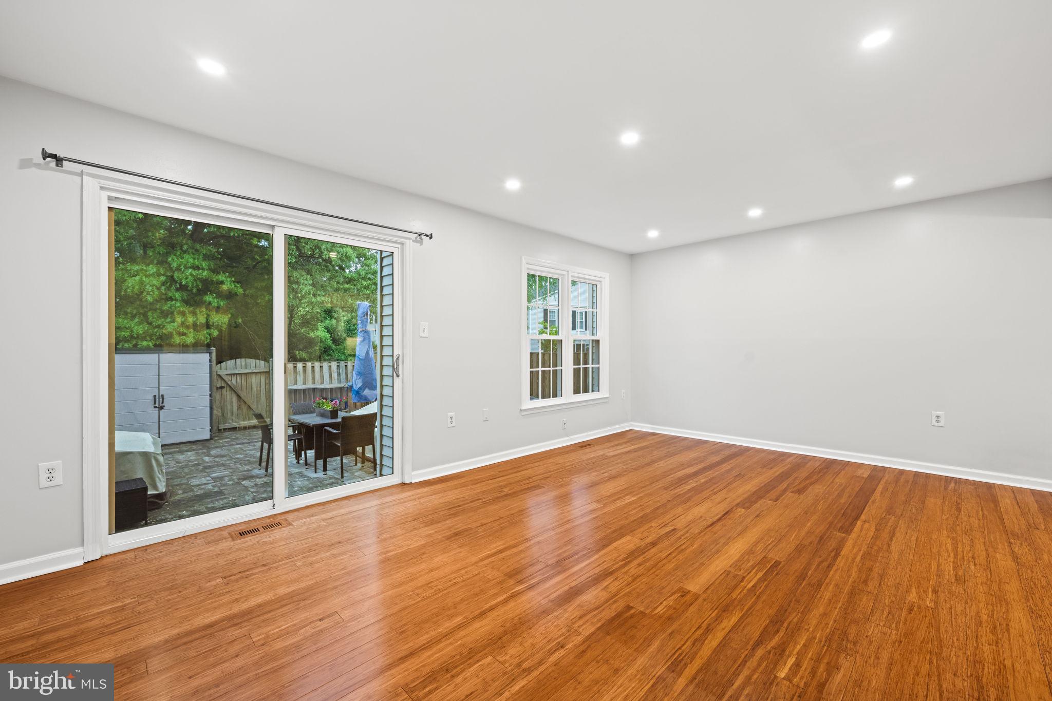 5725 Ridge View Drive Alexandria, VA 22310 - Photo 19 of 53 Living room opening to the rear yard and patio