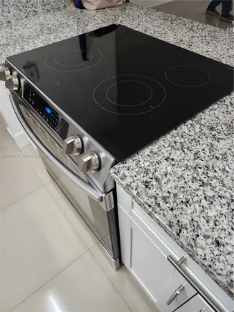 a view of a kitchen with a sink