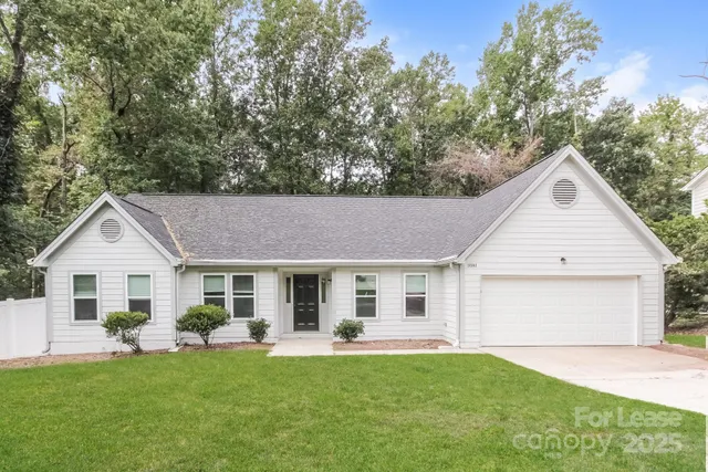 a front view of a house with a garden and porch
