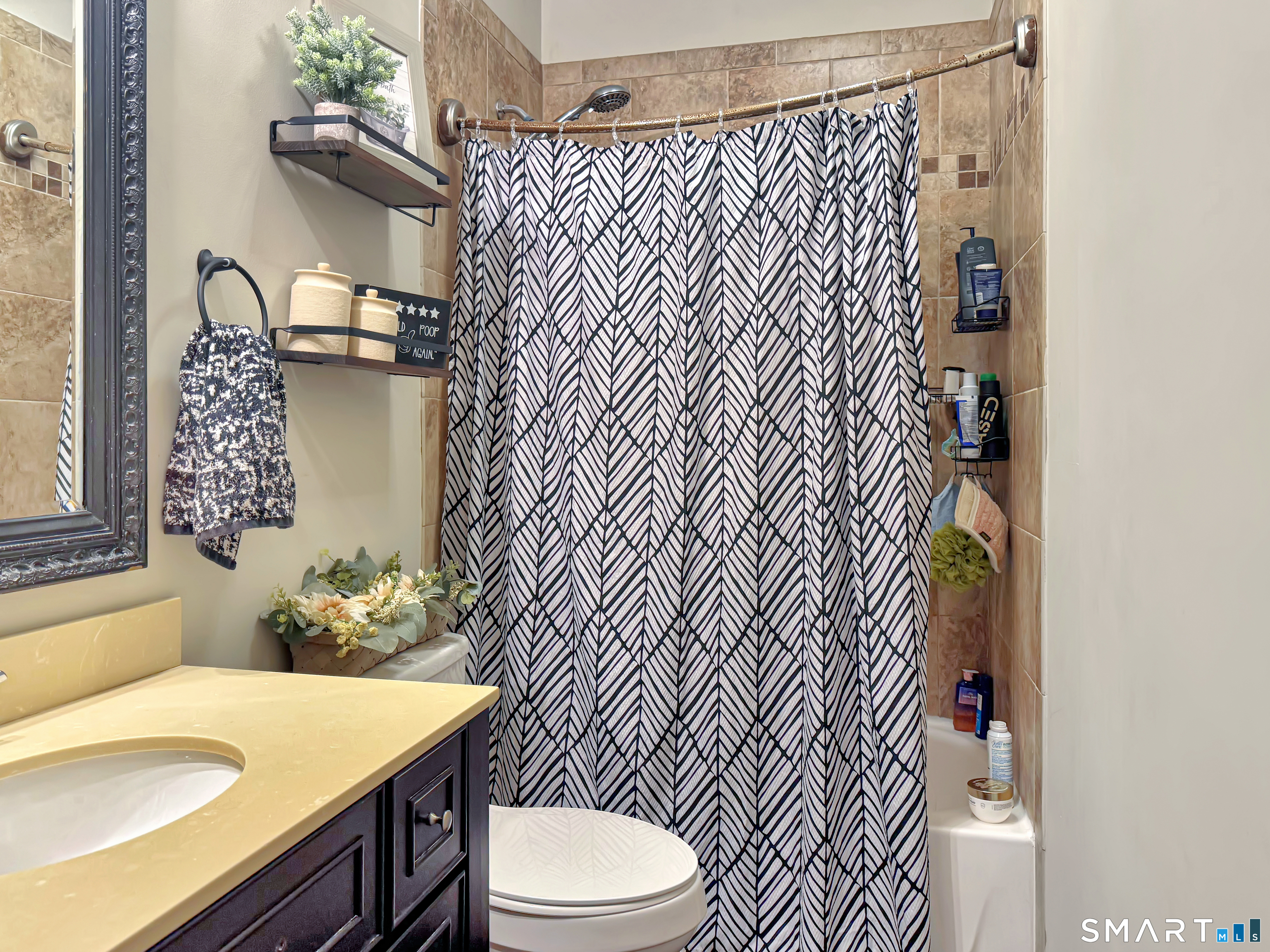 18 Columbia Street Ansonia, CT 06401 - Photo 4 of 16 a bathroom with a sink toilet and shower