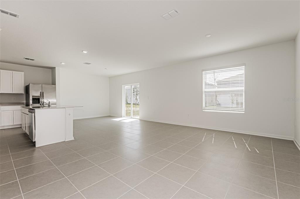 3526 Kimbrough Drive Lake Wales, FL 33853 - Photo 7 of 14 a view of an empty room with kitchen and window