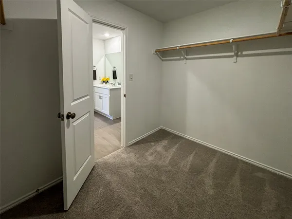 a bedroom with bed and a couch