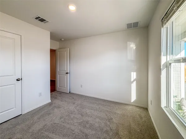 a view of a room with shelf on the wall