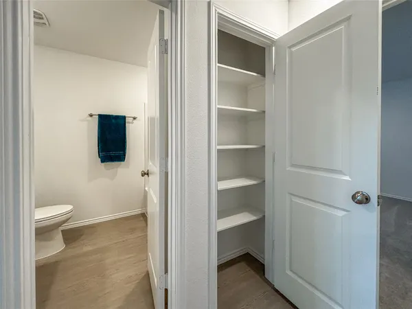 a view of bathroom with a sink mirror and shower