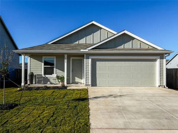 a front view of a house with yard