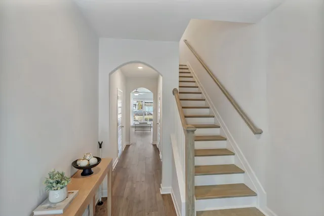a view of entryway and hall with wooden floor