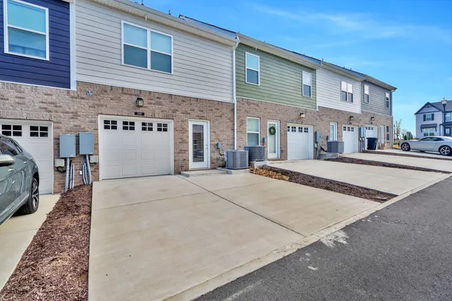 a view of a house with a street