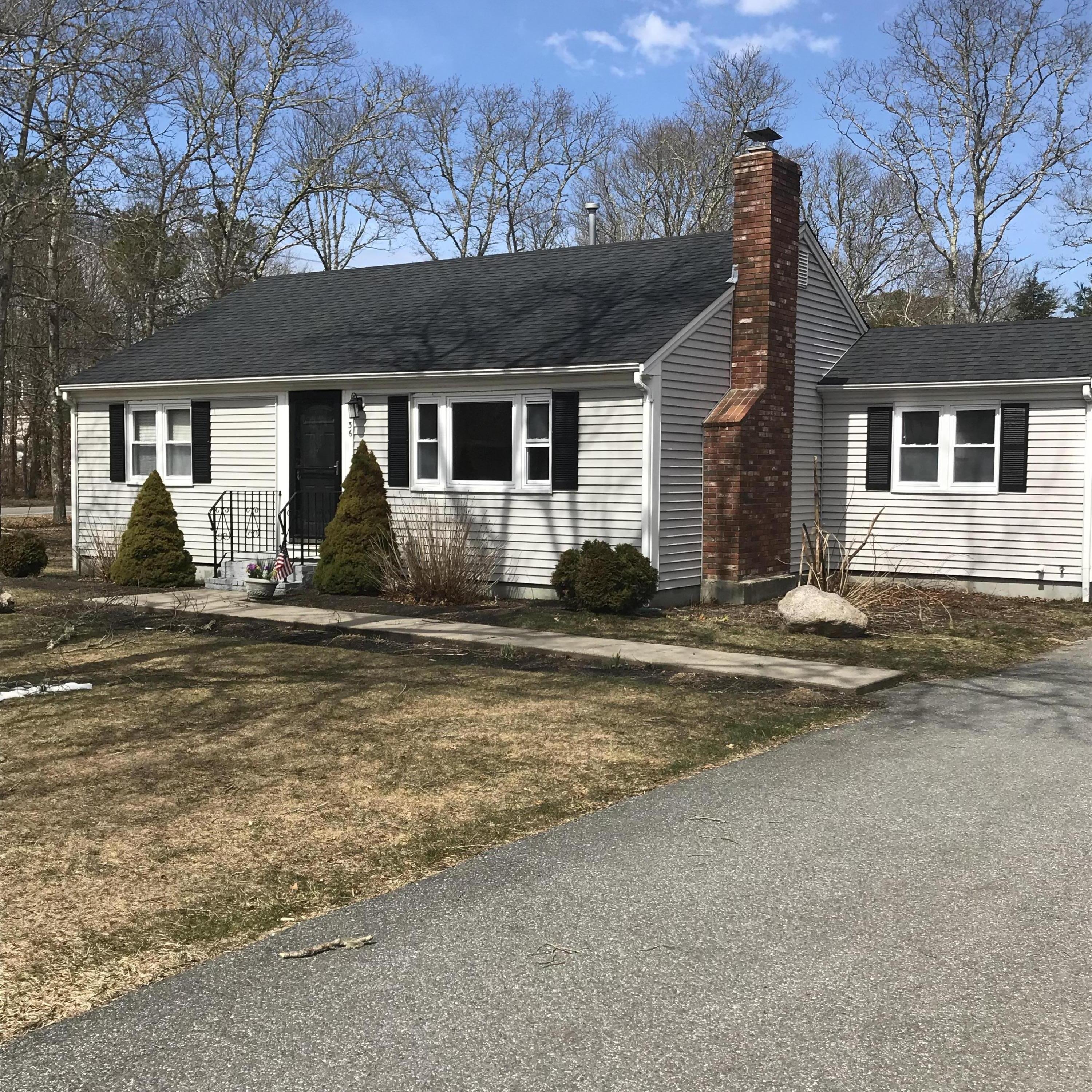 36 Somerset Road Mashpee, MA 02649 - Photo 1 of 17 a front view of a house with yard