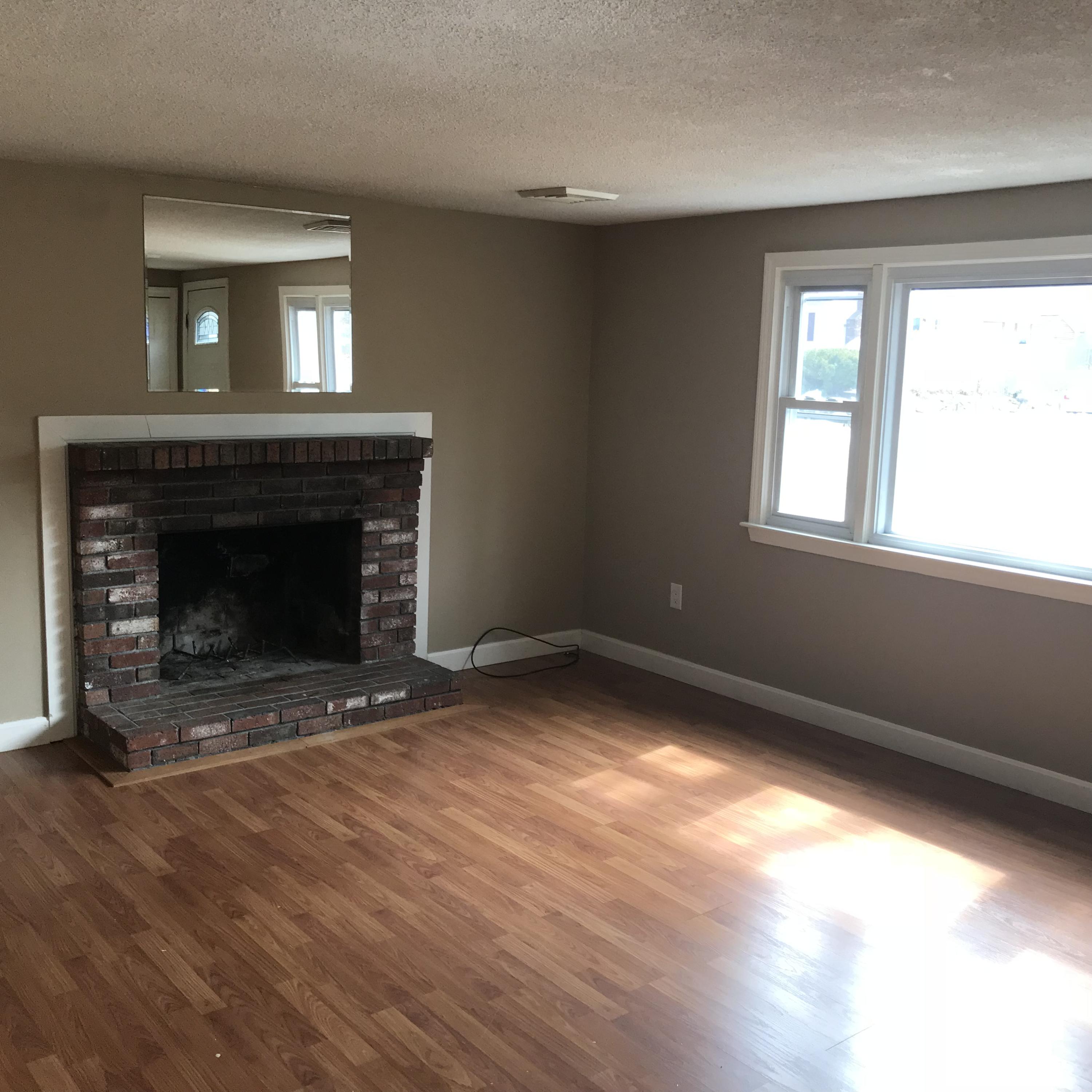 36 Somerset Road Mashpee, MA 02649 - Photo 12 of 17 a view of empty room with wooden floor and a fireplace