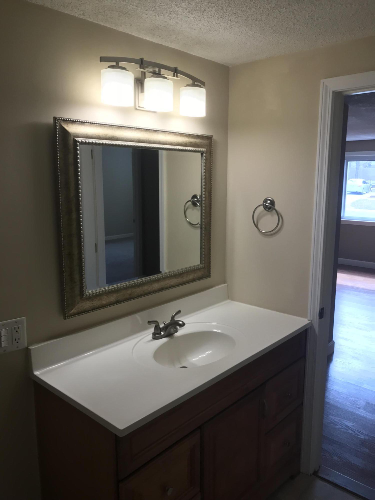36 Somerset Road Mashpee, MA 02649 - Photo 14 of 17 a bathroom with a sink vanity and mirror
