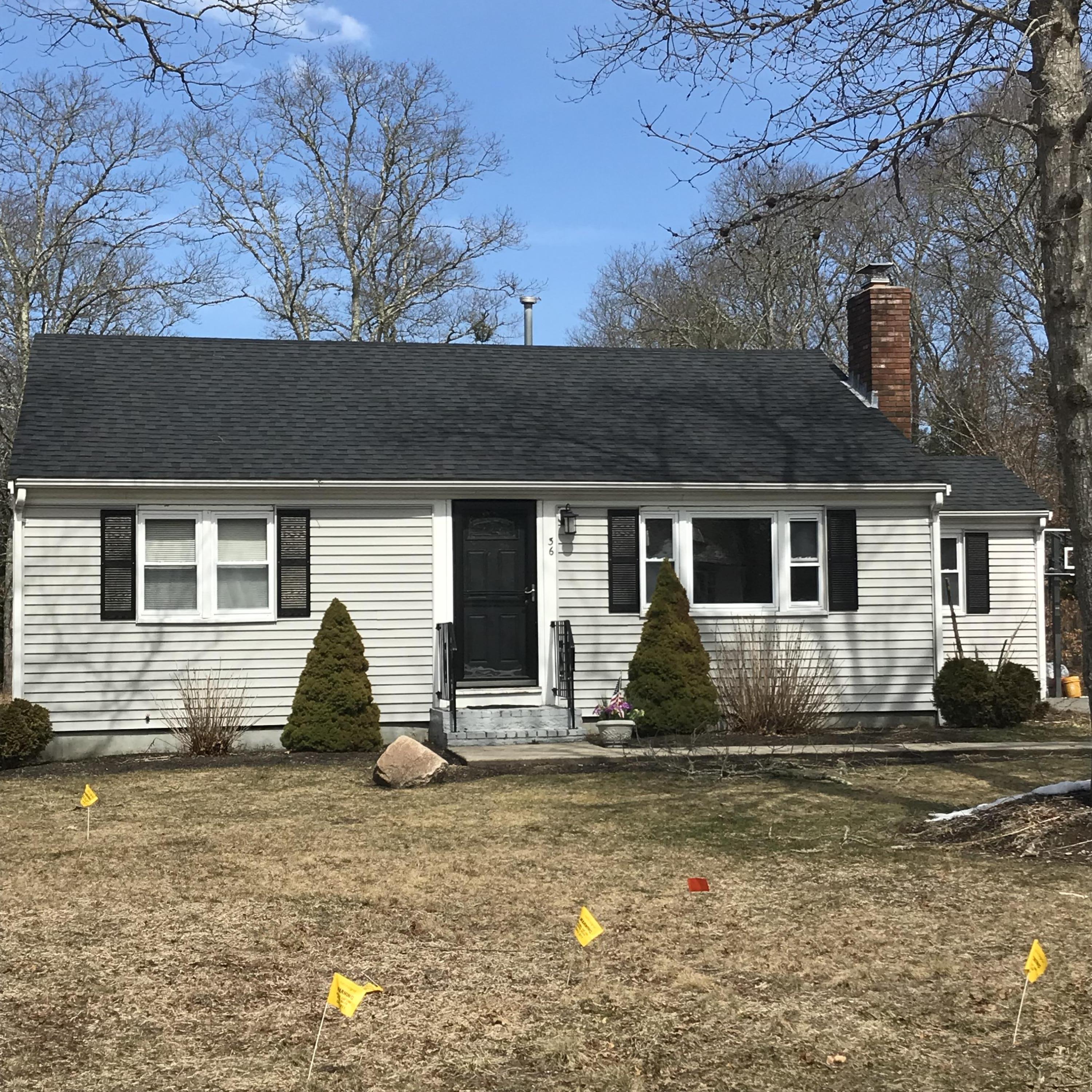 36 Somerset Road Mashpee, MA 02649 - Photo 2 of 17 a front view of a house with a yard