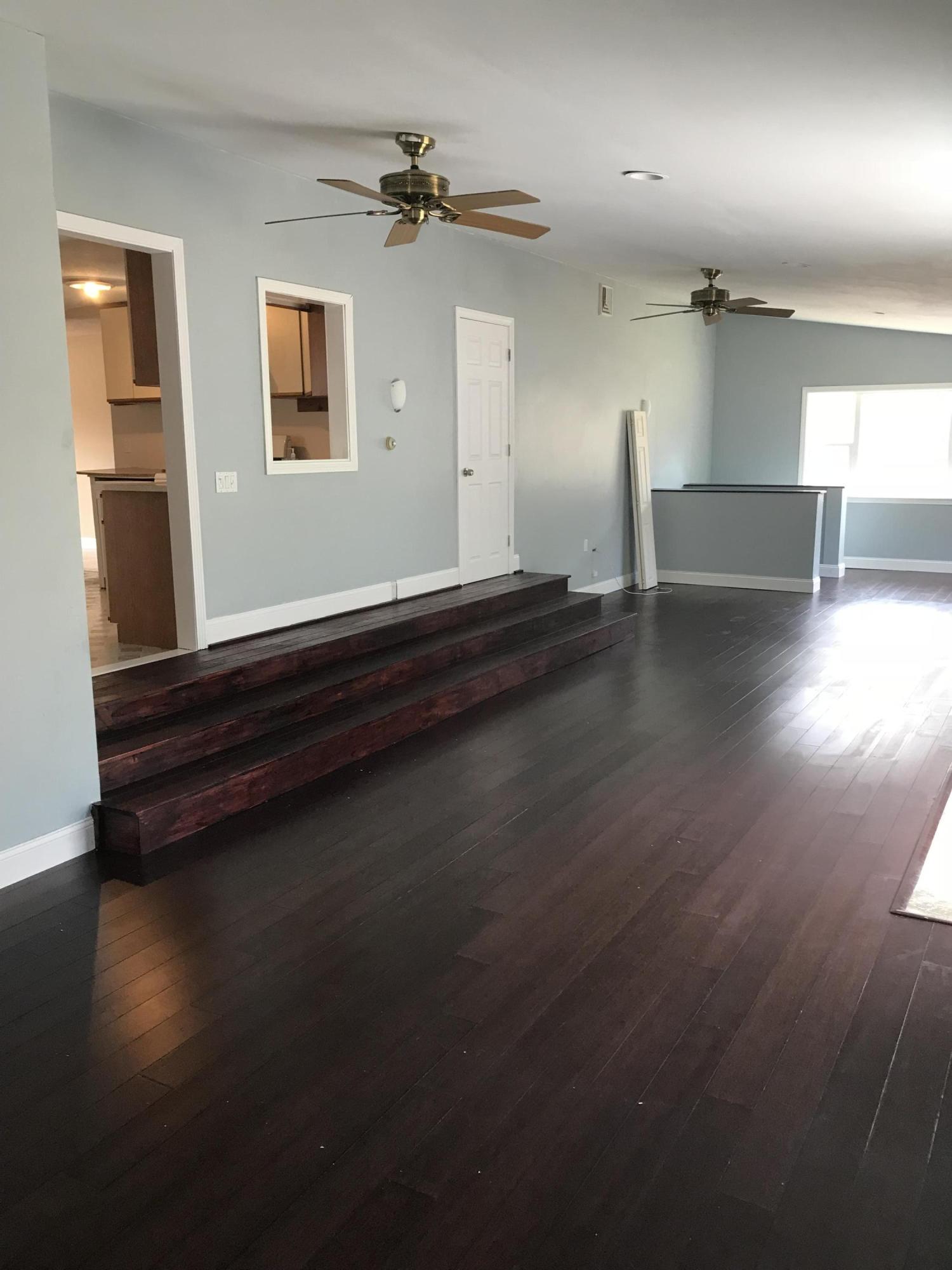 36 Somerset Road Mashpee, MA 02649 - Photo 6 of 17 an empty room with wooden floor and windows