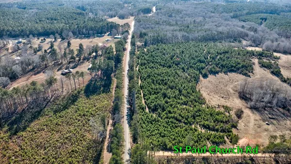 a view of a wooden house with a yard