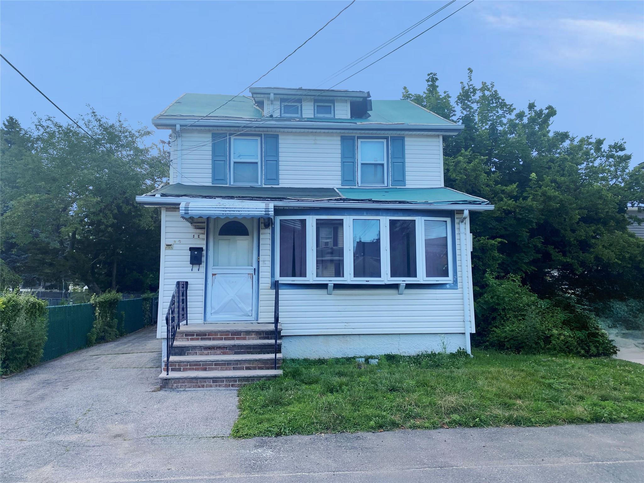 front view of a house with a yard