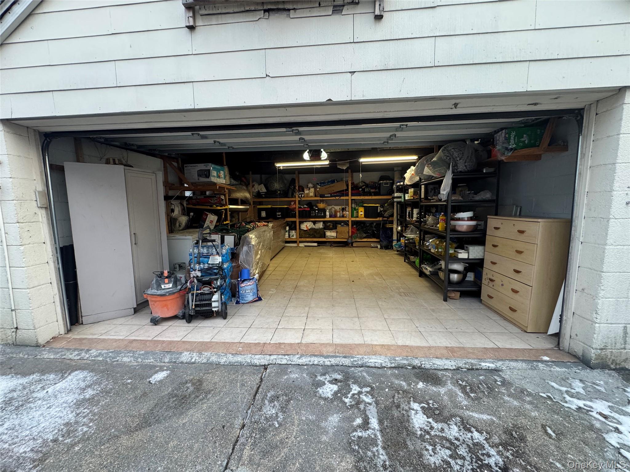 171-28 103rd Road Queens, NY 11433 - Photo 17 of 21 a view of a storage room with rack and bicycle