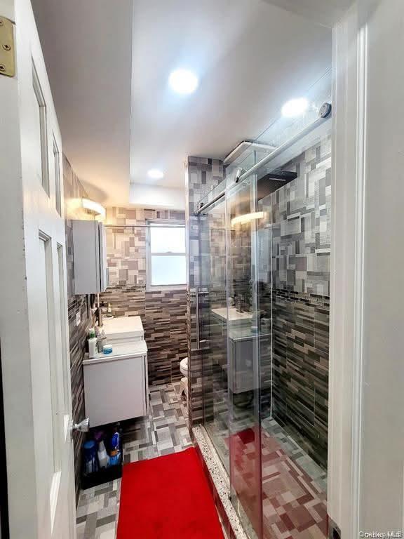 171-28 103rd Road Queens, NY 11433 - Photo 5 of 21 a room with storage and utility