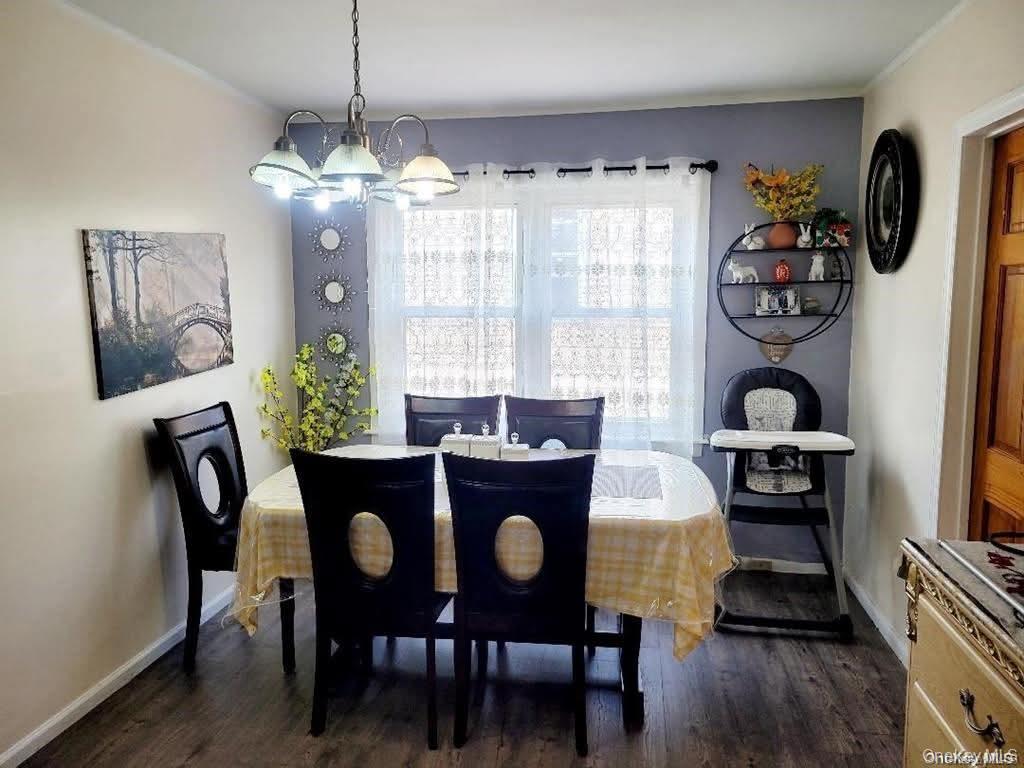 171-28 103rd Road Queens, NY 11433 - Photo 8 of 21 a dining room with furniture and window