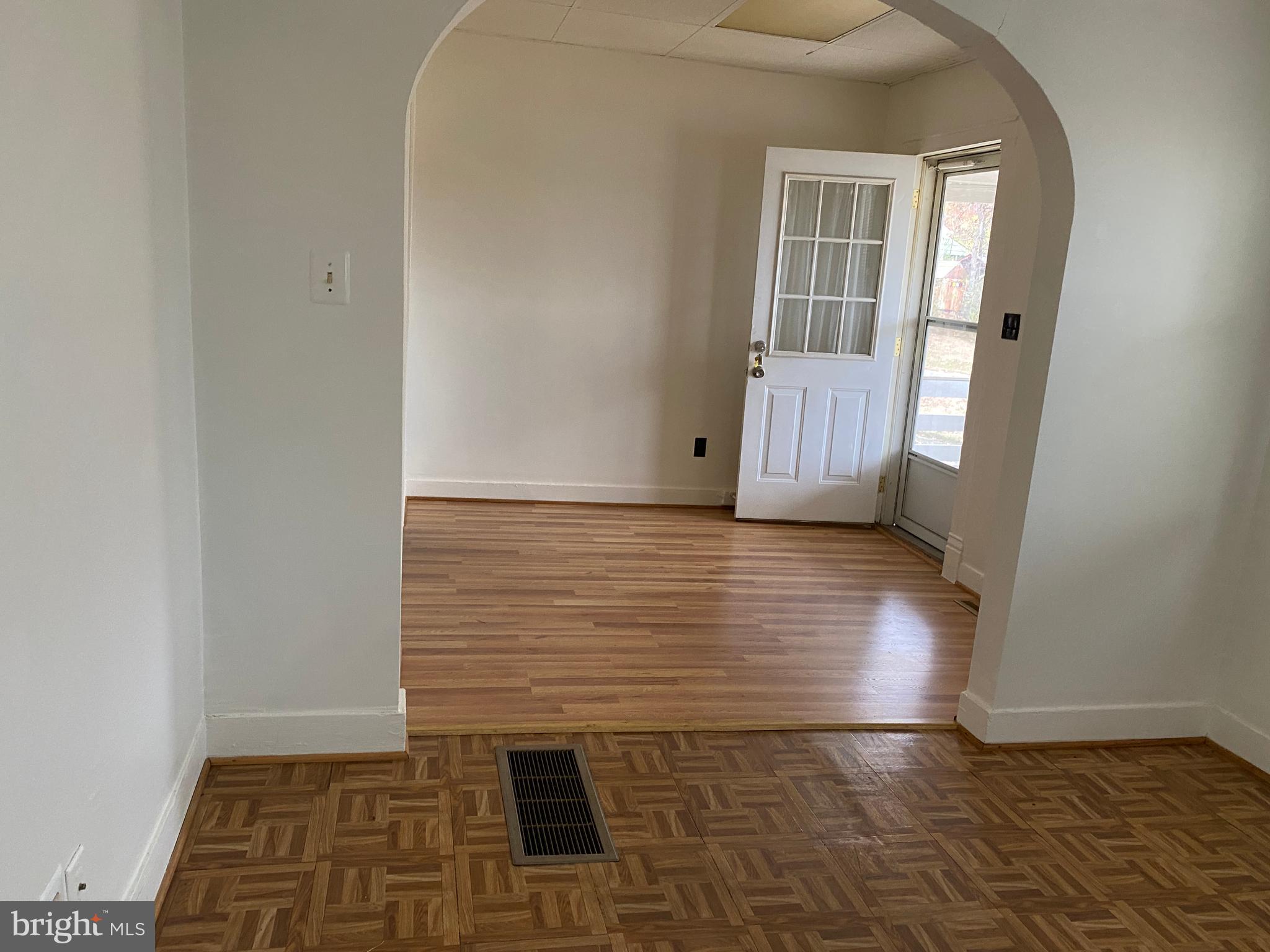 4002 Post Street Triangle, VA 22172 - Photo 5 of 7 an empty room with wooden floor and windows