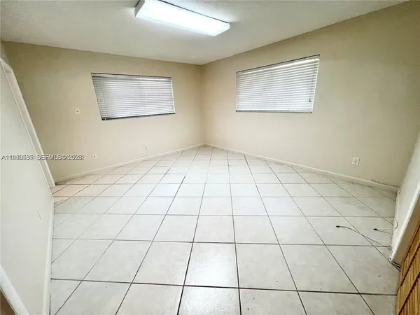 a view of a livingroom and window