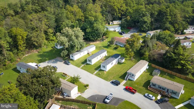 an aerial view of a house having yard