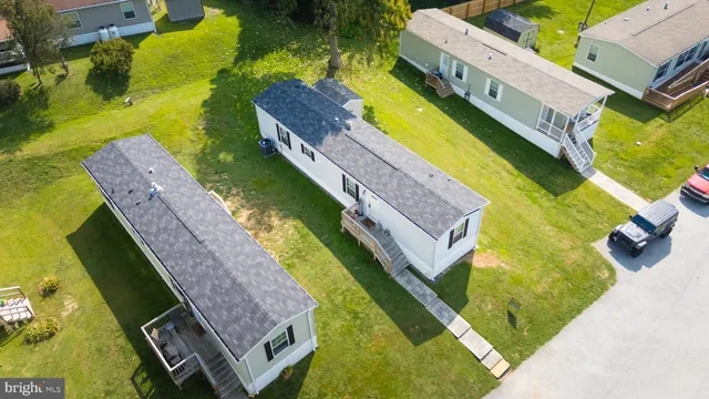 an aerial view of a house with a swimming pool