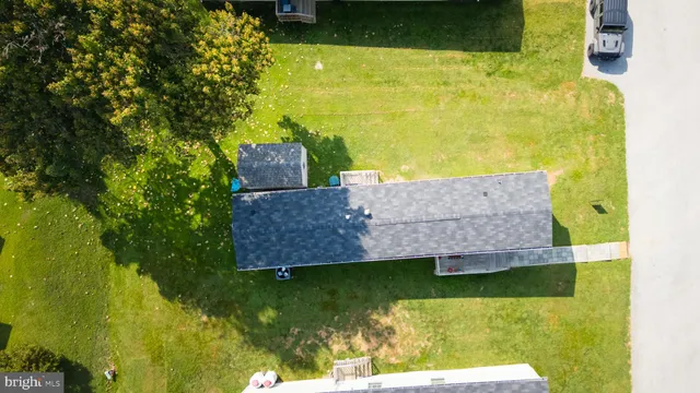 a view of a swimming pool with a yard